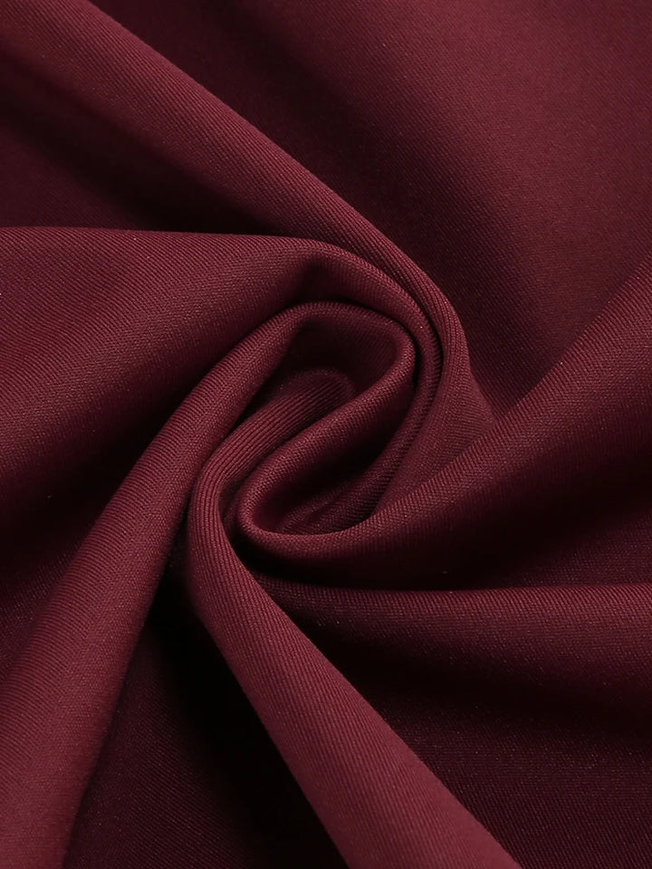 Close-up of burgundy ruched fabric with soft twist texture
