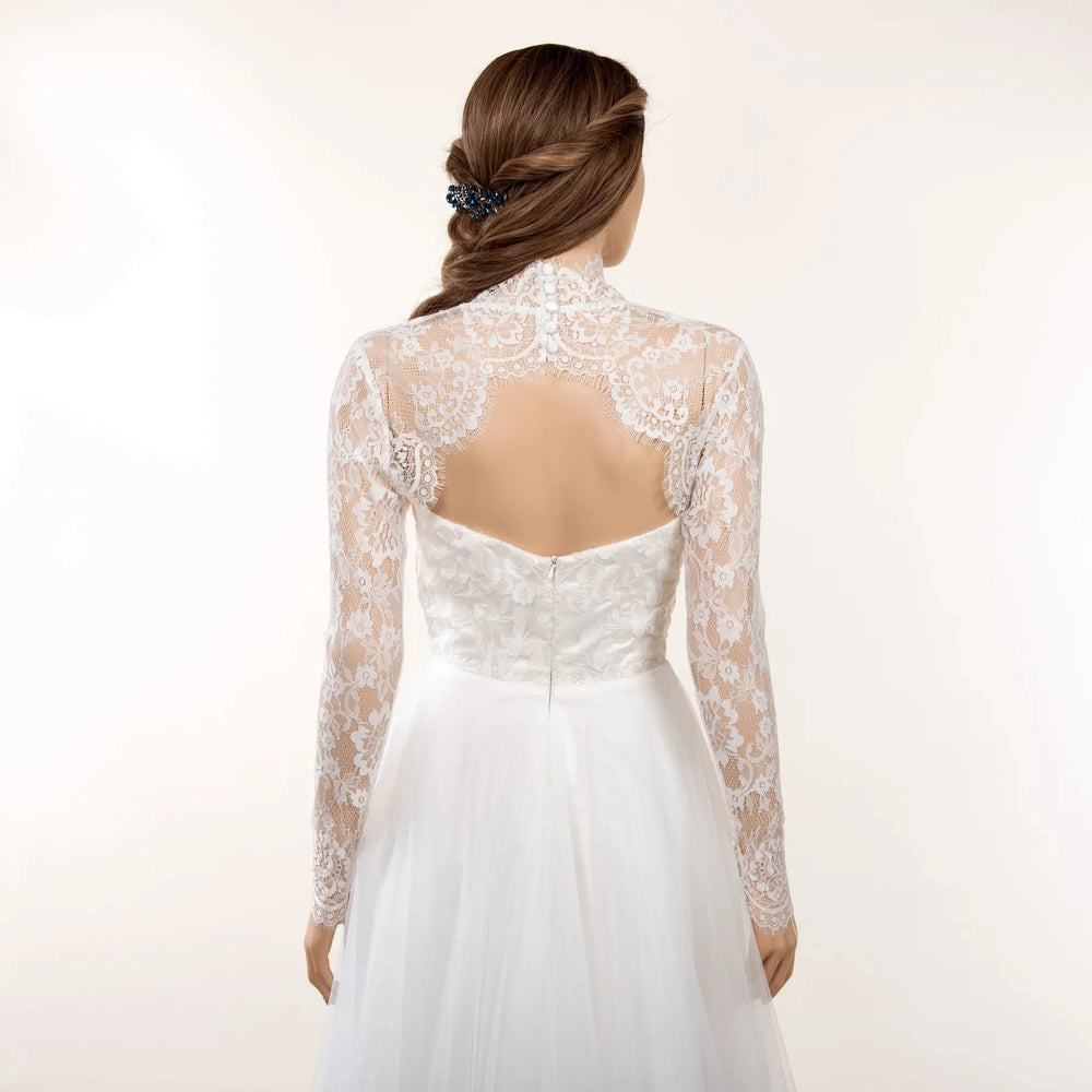 White lace bridal jacket with high scalloped collar and sheer back