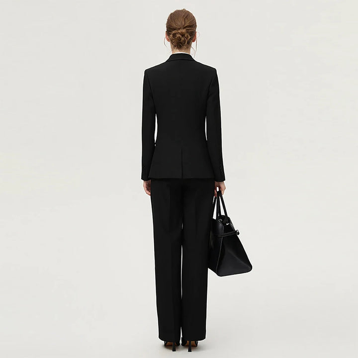 Women’s black two-piece blazer suit, tailored blazer and wide-leg trousers, back view