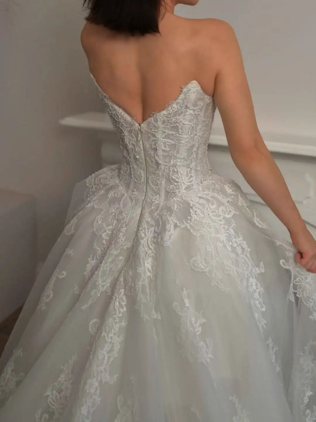 Ivory lace bridal gown with corset back and A-line tulle skirt