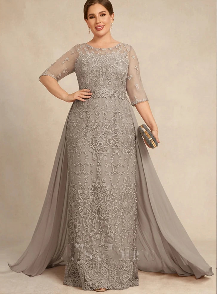 Woman wearing a silver lace evening gown with &