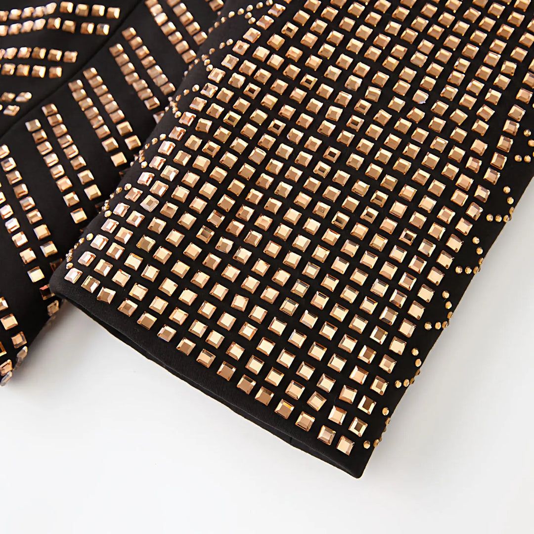 Gold rhinestone hem trim on black formal blazer cuff edge