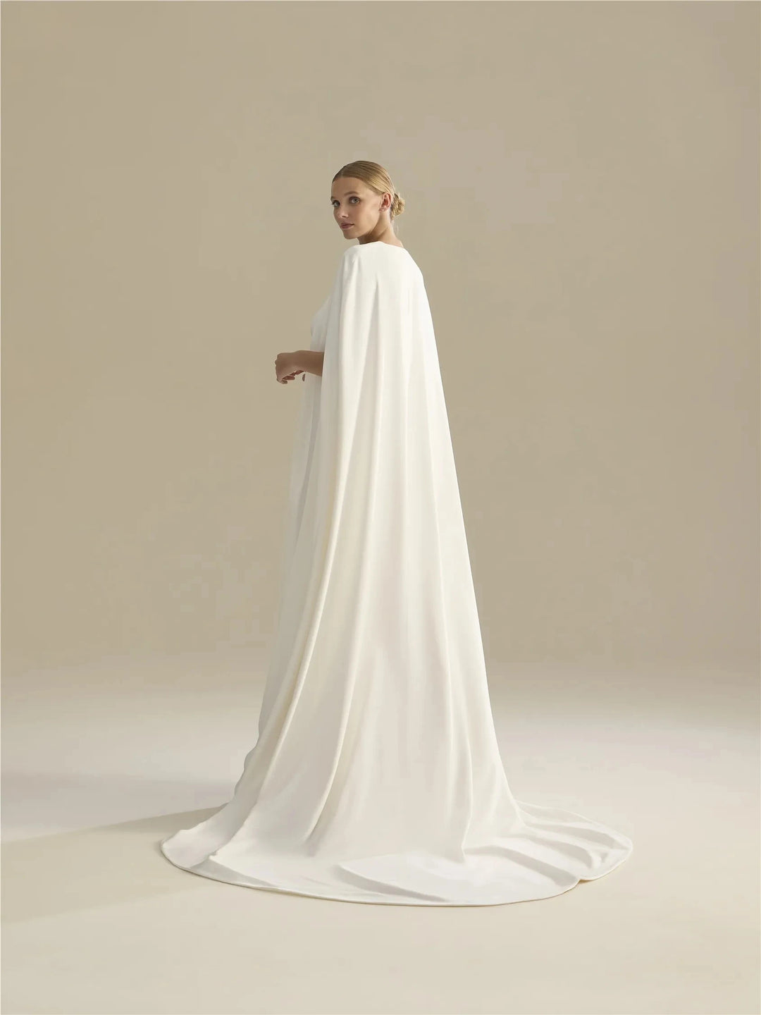 Off-white long train bridal cape with floor-sweeping hem