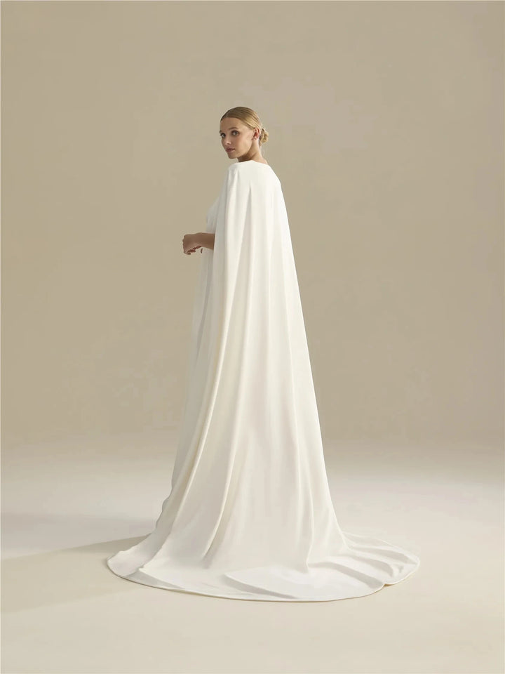 Off-white long train bridal cape with floor-sweeping hem