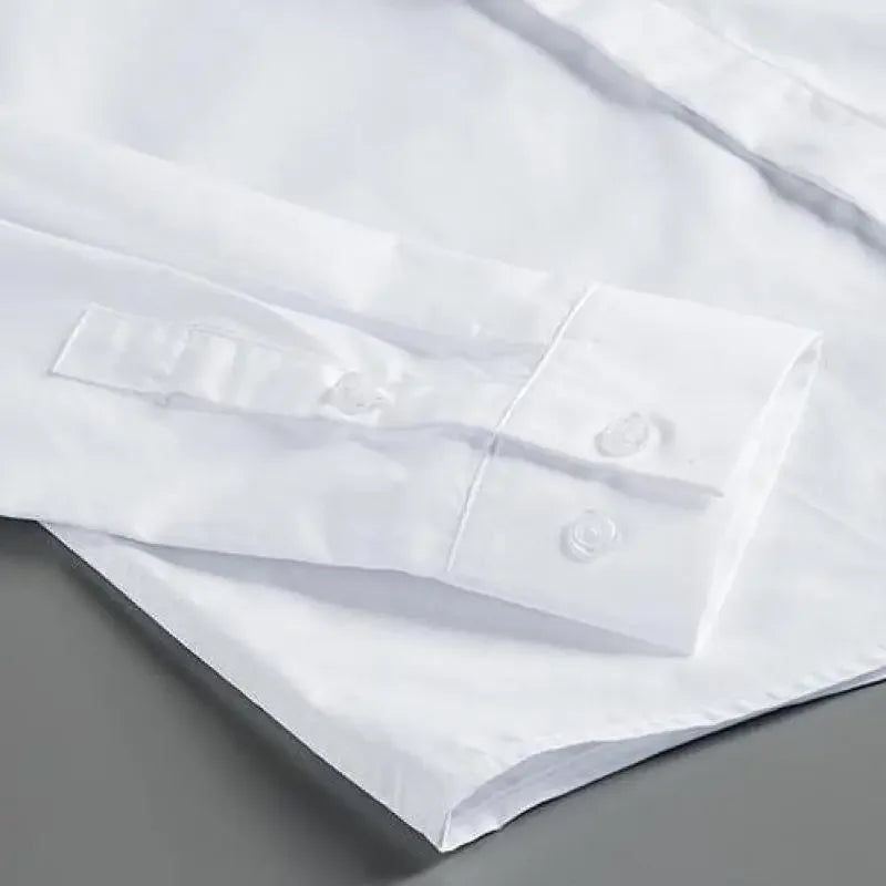 White button-up shirt front placket with small round buttons and folded collar