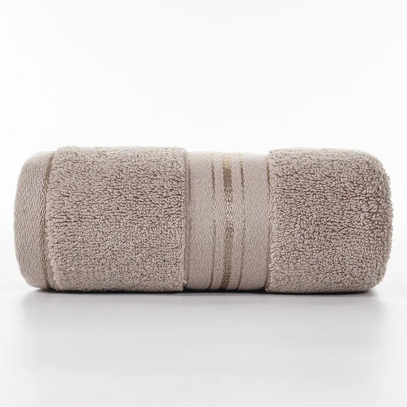 Khaki beige face towel roll with stitched stripe bands and plush looped texture
