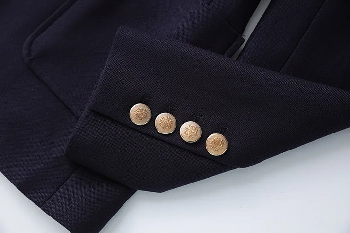 Navy blazer cuff with four round gold buttons