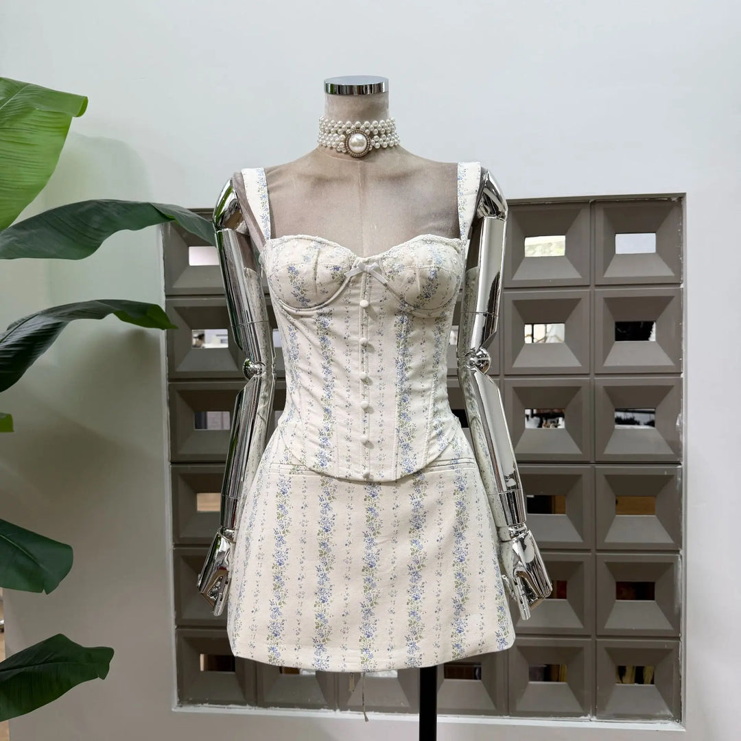 Two-piece set: blue floral corset top and mini skirt on mannequin