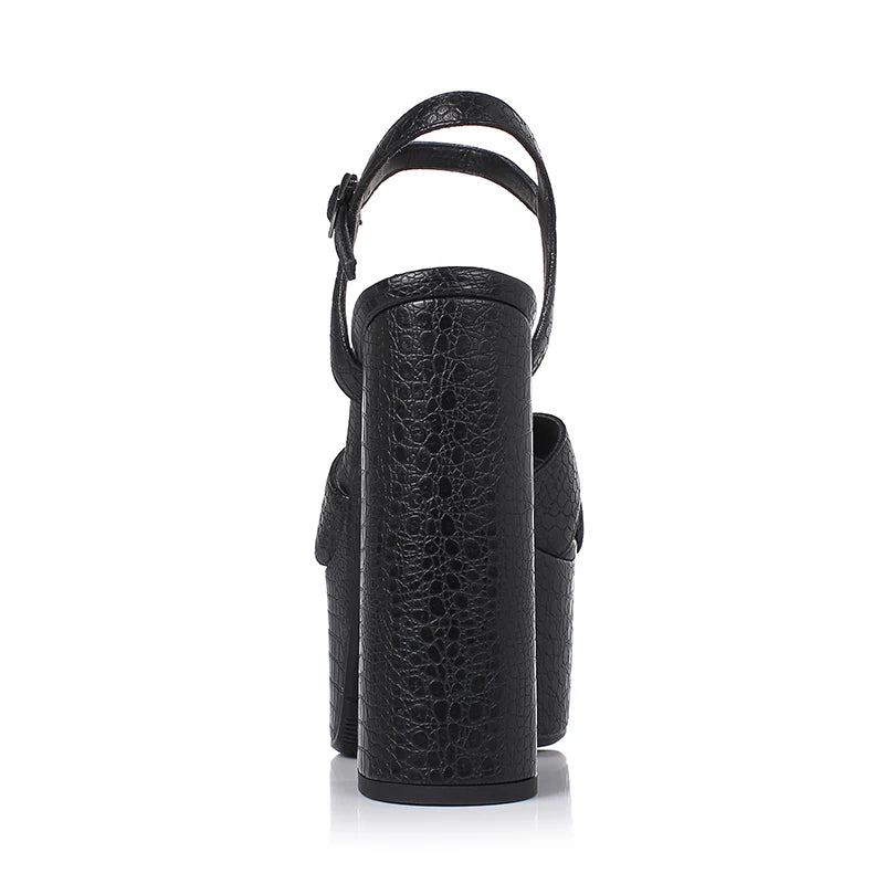 Black embossed cowhide heeled platform sandal with ankle strap, side view