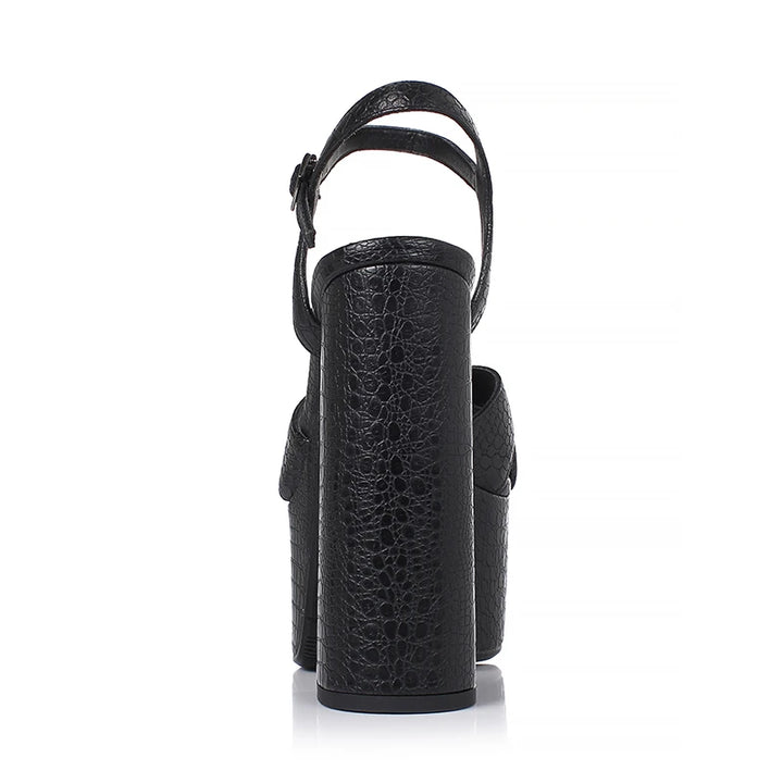 Black embossed cowhide heeled platform sandal with ankle strap, side view