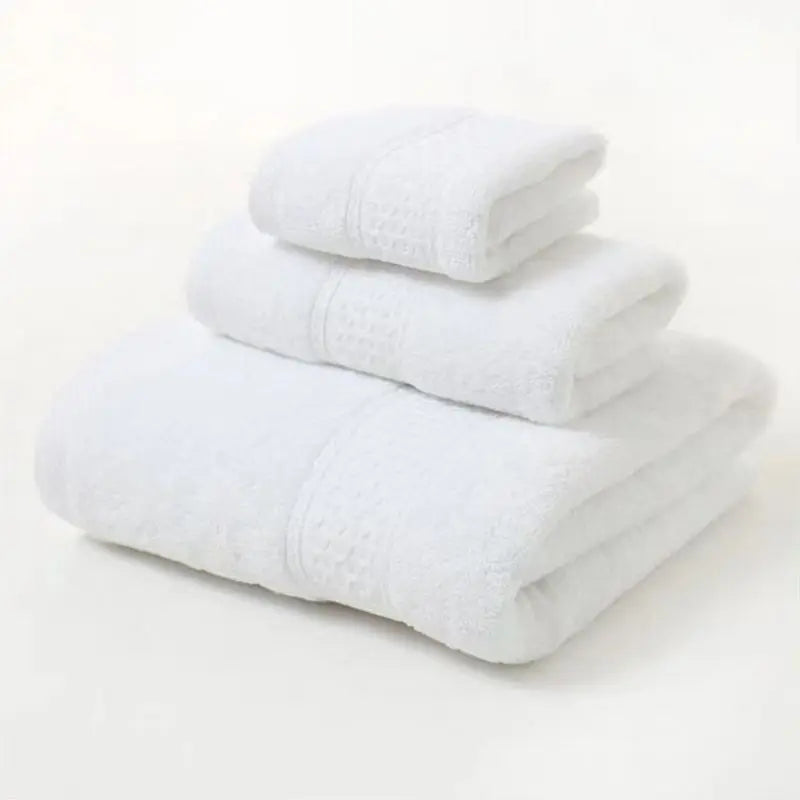 White organic cotton towel set, 3-pc folded stack with textured borders and patterned center