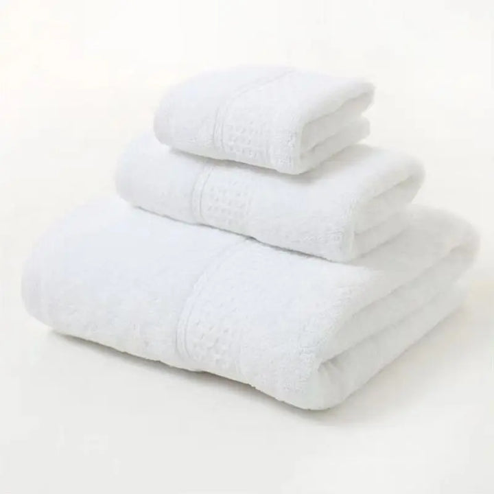 White organic cotton towel set, 3-pc folded stack with textured borders and patterned center