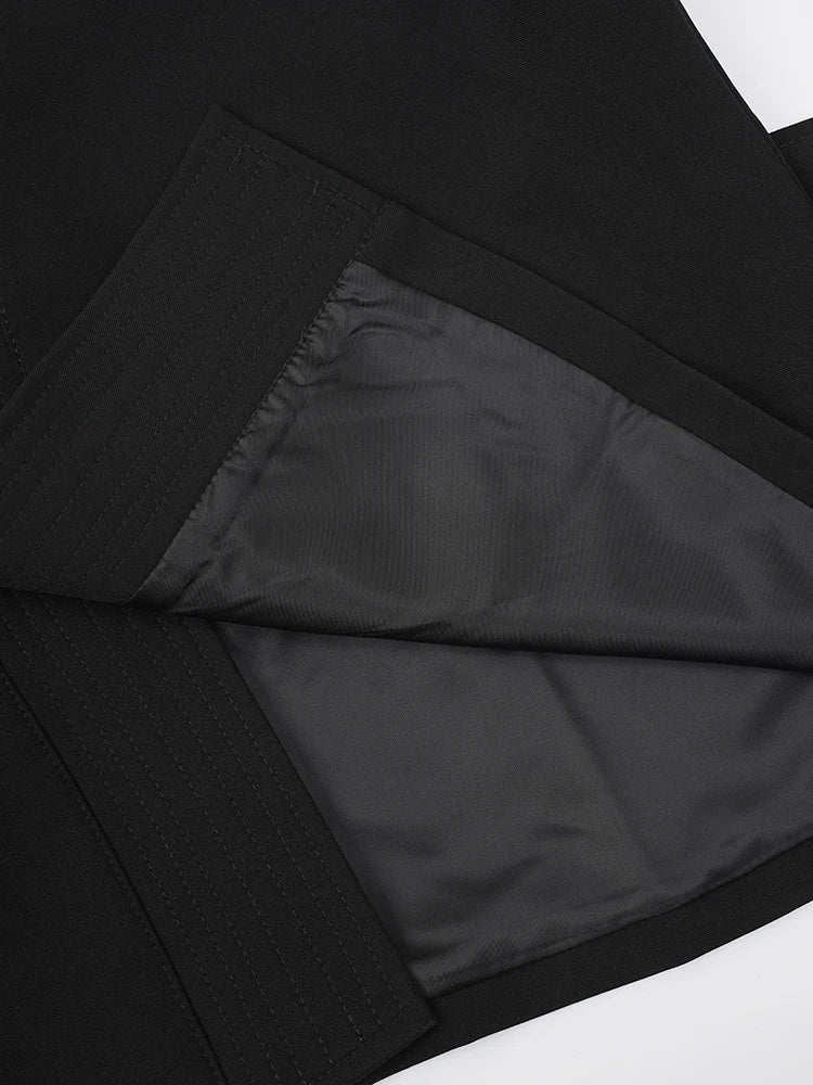 Black vest interior lining with V-shaped cut and stitched seam