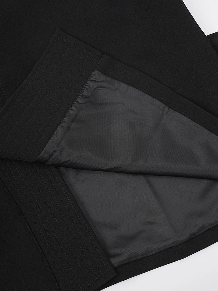 Black vest interior lining with V-shaped cut and stitched seam