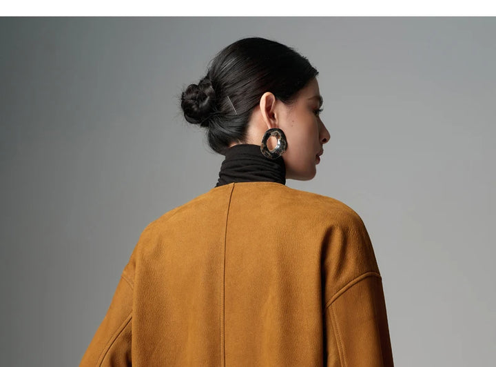 Yellow-brown sheepskin leather jacket back with center seam and high collar