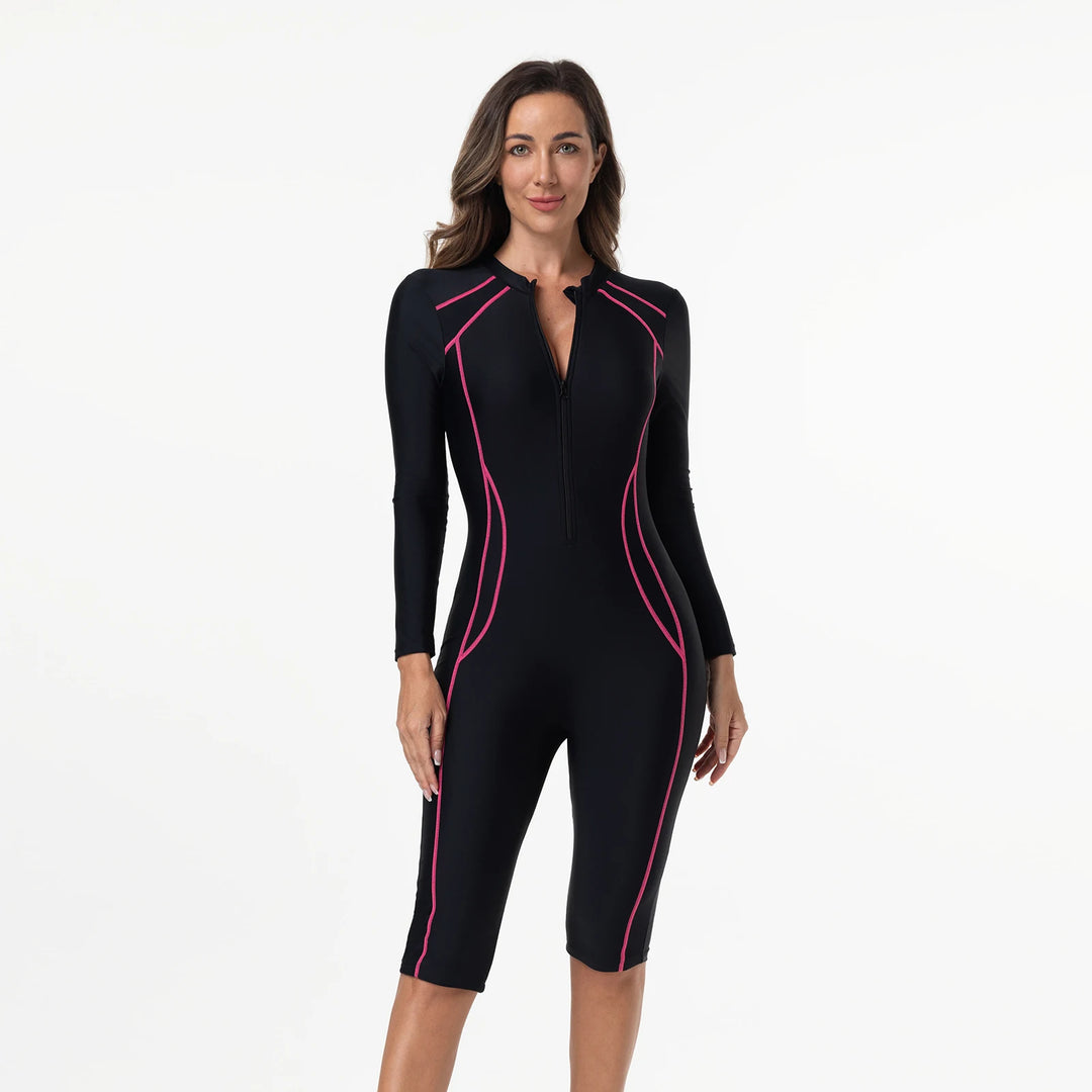 Black one-piece swimwear with long sleeves, magenta piping, and zip-front neckline detail