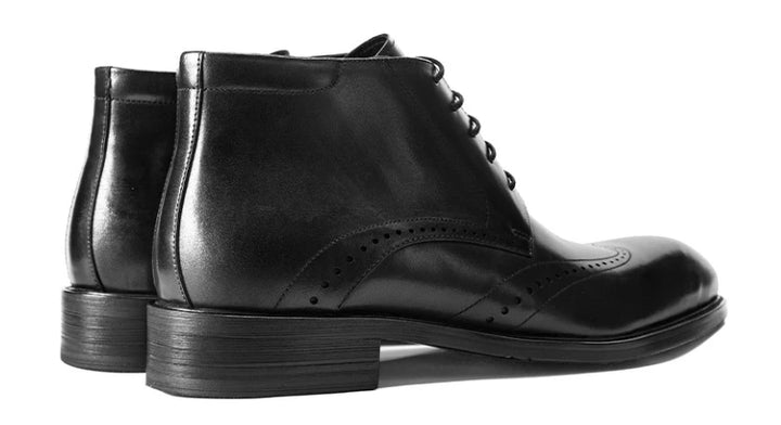 Black lace-up brogue ankle boots, side view with pull tab and stacked heel