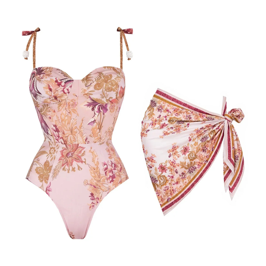 Pink floral corset-style swim bodysuit with tie straps and matching wrap bottom