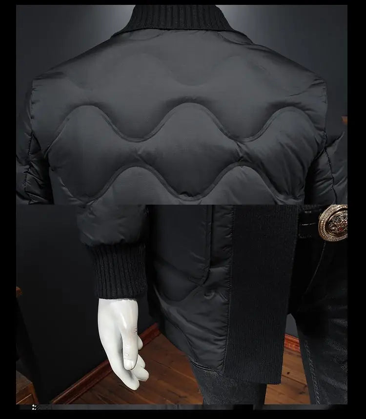 Black mid-length puffer coat on mannequin, ribbed knit cuffs and wavy back quilting