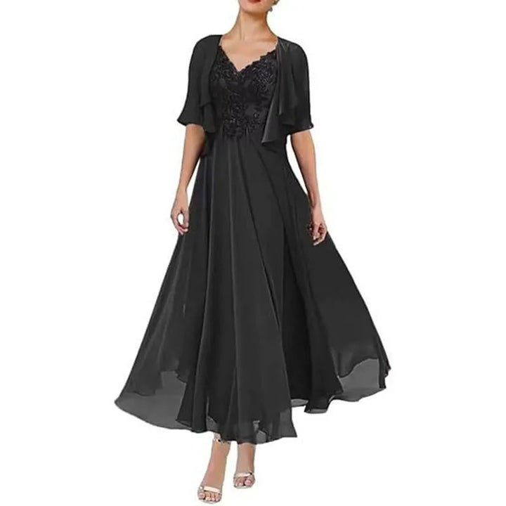 Black tea-length chiffon gown with embroidered V-neck bodice