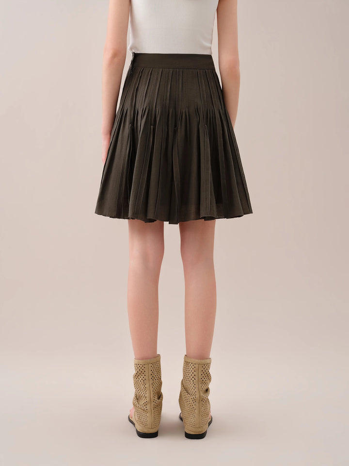 Dark brown pleated mini skirt with elastic waistband, mid-thigh length