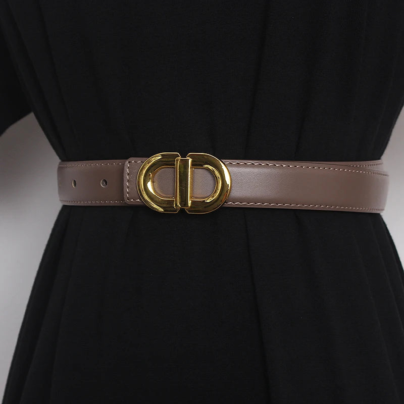 Brown narrow leather waist belt with gold-tone double D buckle and punched holes