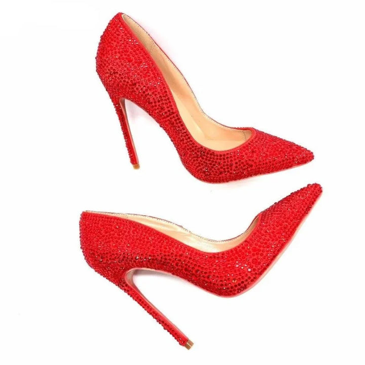 Red rhinestone pointed-toe high heel pumps set showing side profile and sole