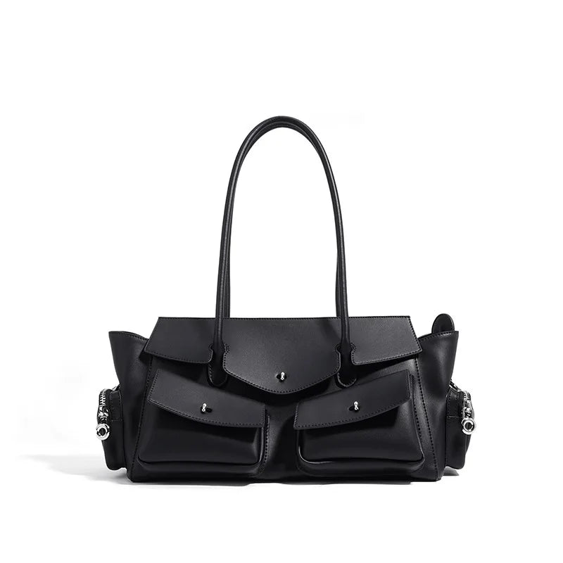 Black underarm handbag with structured front flap, top handles, and side zipper accents