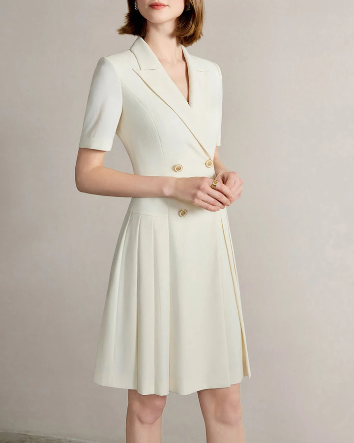 Beige A-line notched-collar dress with short sleeves, gold buttons, pleated skirt