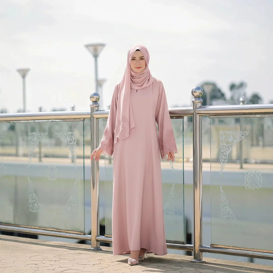 Blush pink modest abaya dress with matching headscarf, lace accents on sleeves