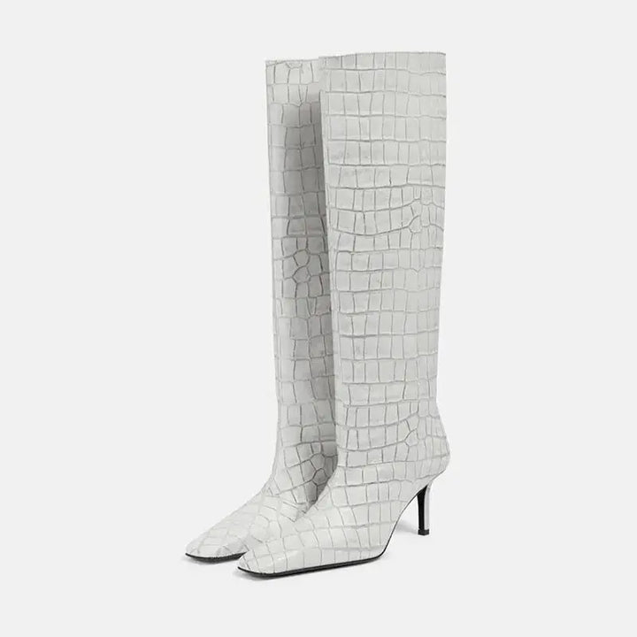 Women’s knee-high croc-grain boots in white, pull-on style with slim heel