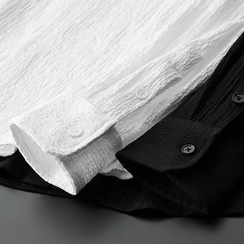 Close-up of white and black shirt collars and buttons