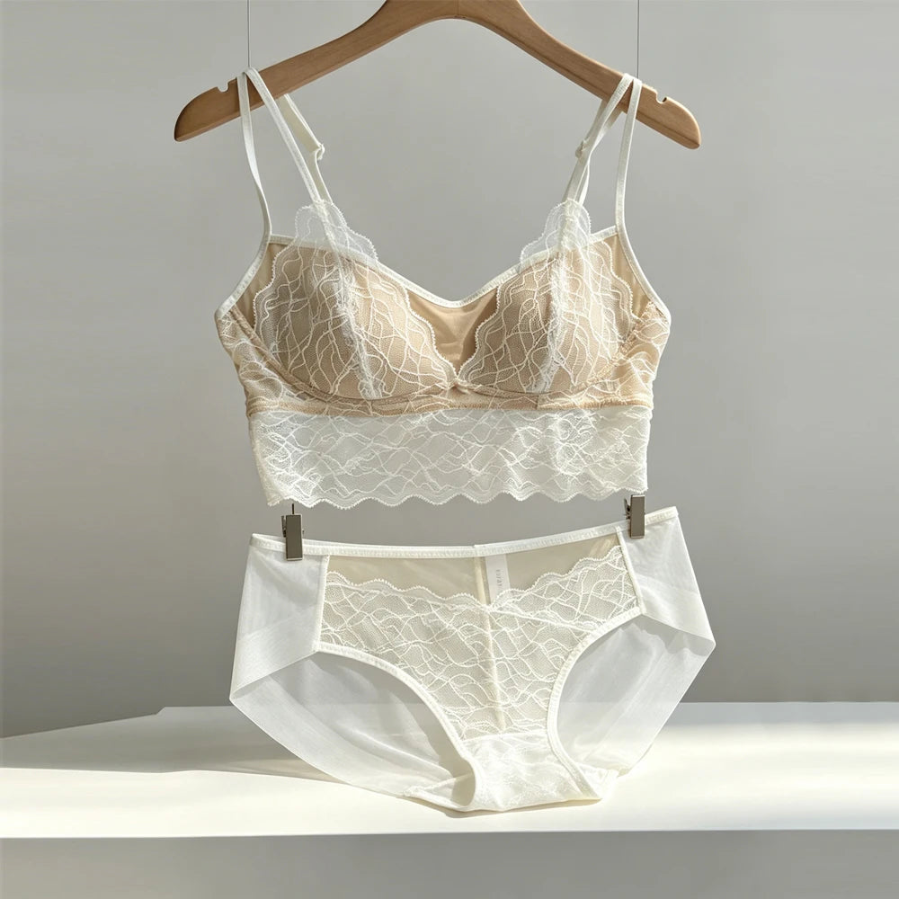 Champagne lace lingerie bra and high-rise panties set on hangers