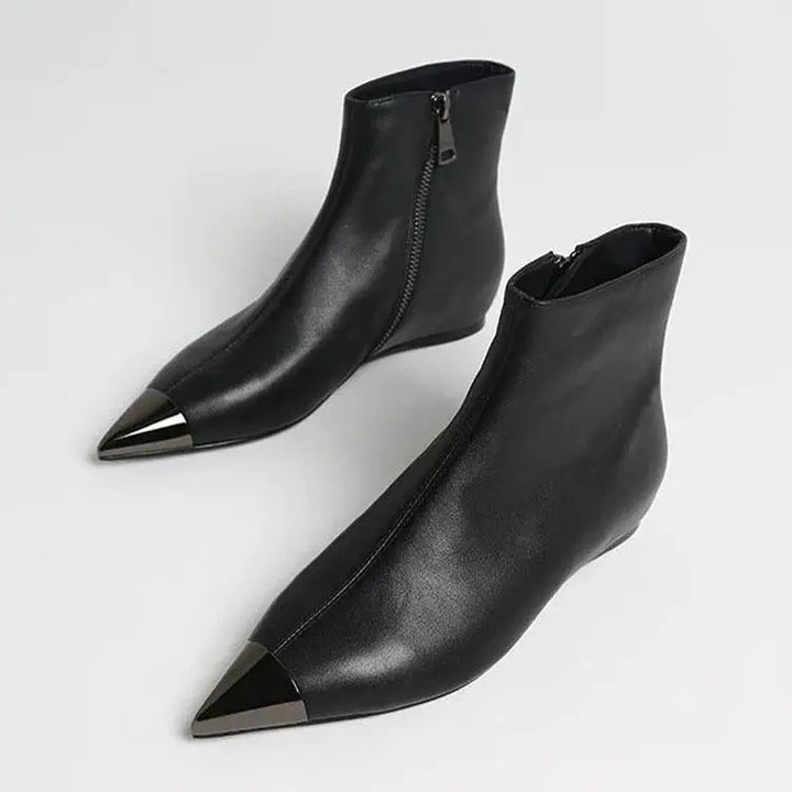 Black pointed-toe ankle heel boots with side zipper closure and smooth leather upper.