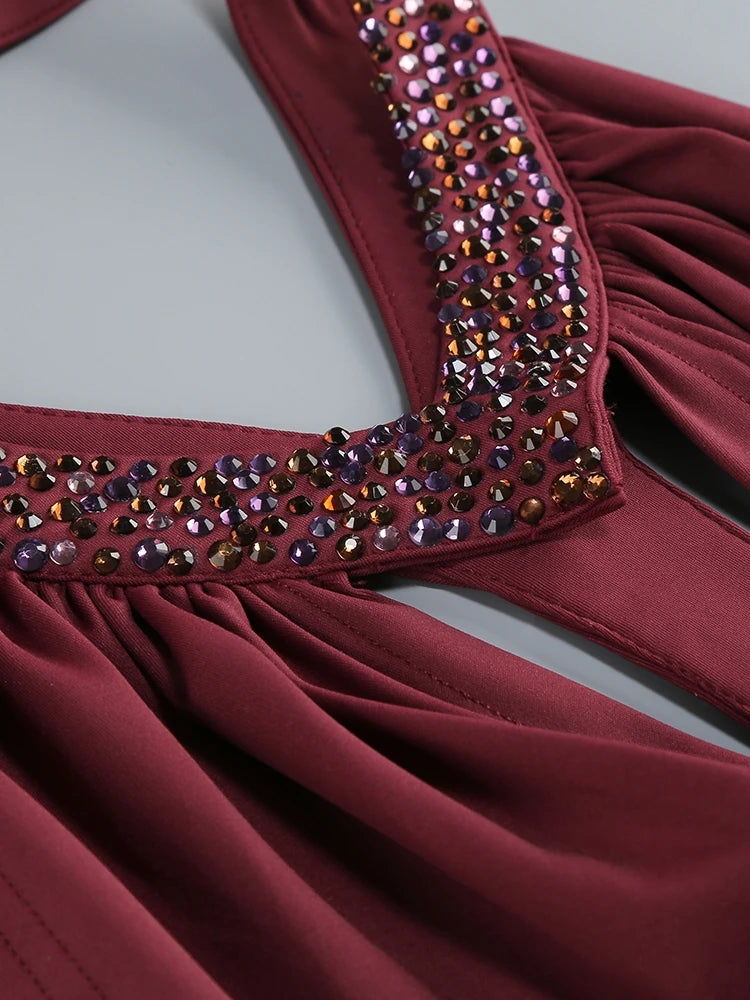 Burgundy halter mini gown close-up of crystal-trimmed neckline and ruched fabric