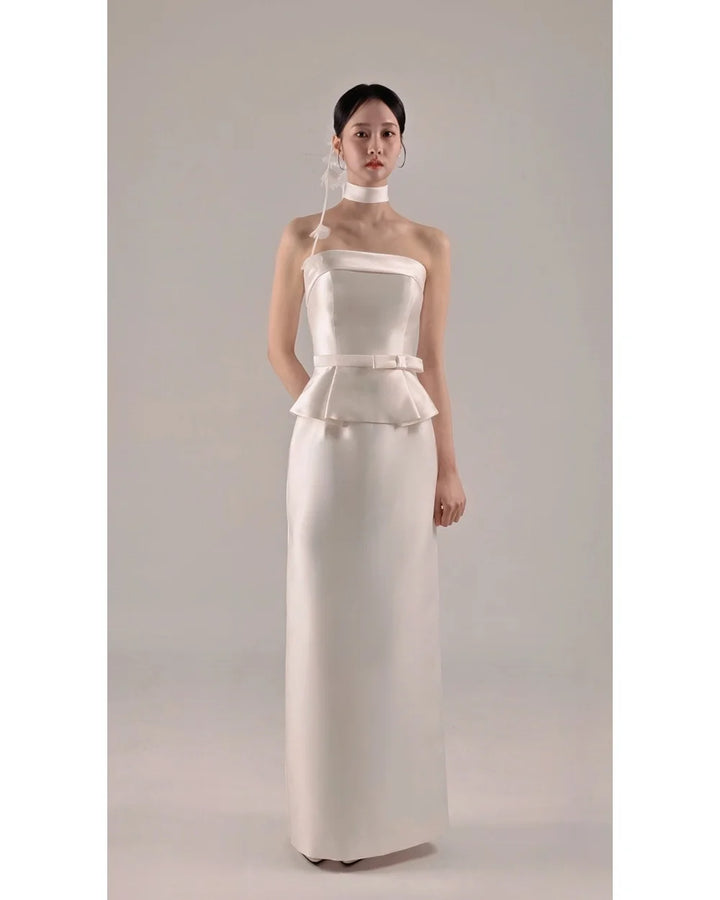 Strapless satin wedding dress in white with peplum peplum waist detail and long skirt