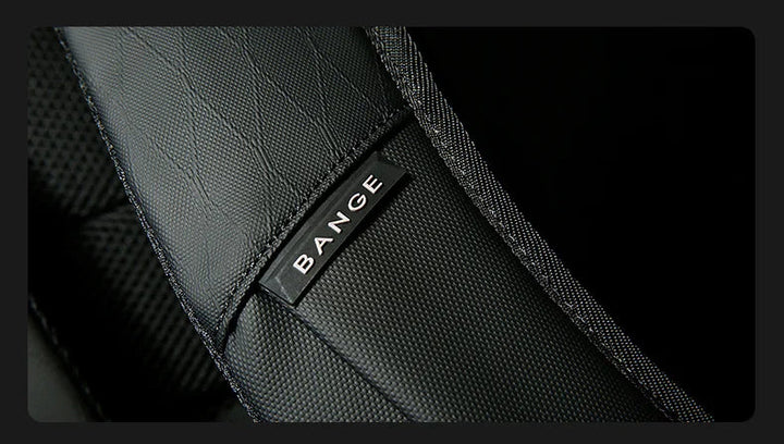 Black backpack branding patch with BANGE logo on pocket seam