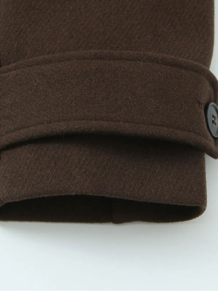 Dark brown overcoat cuff with knit-style hem and button detail