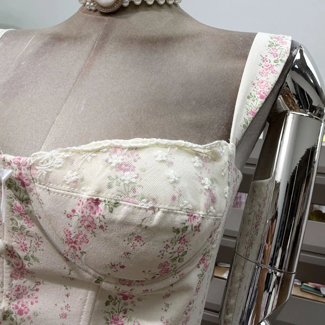 Close-up of pink floral print corset bodice with sweetheart neckline detail