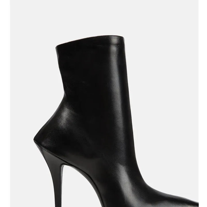 Black high-heel ankle boots with side zipper and sleek pointed toe