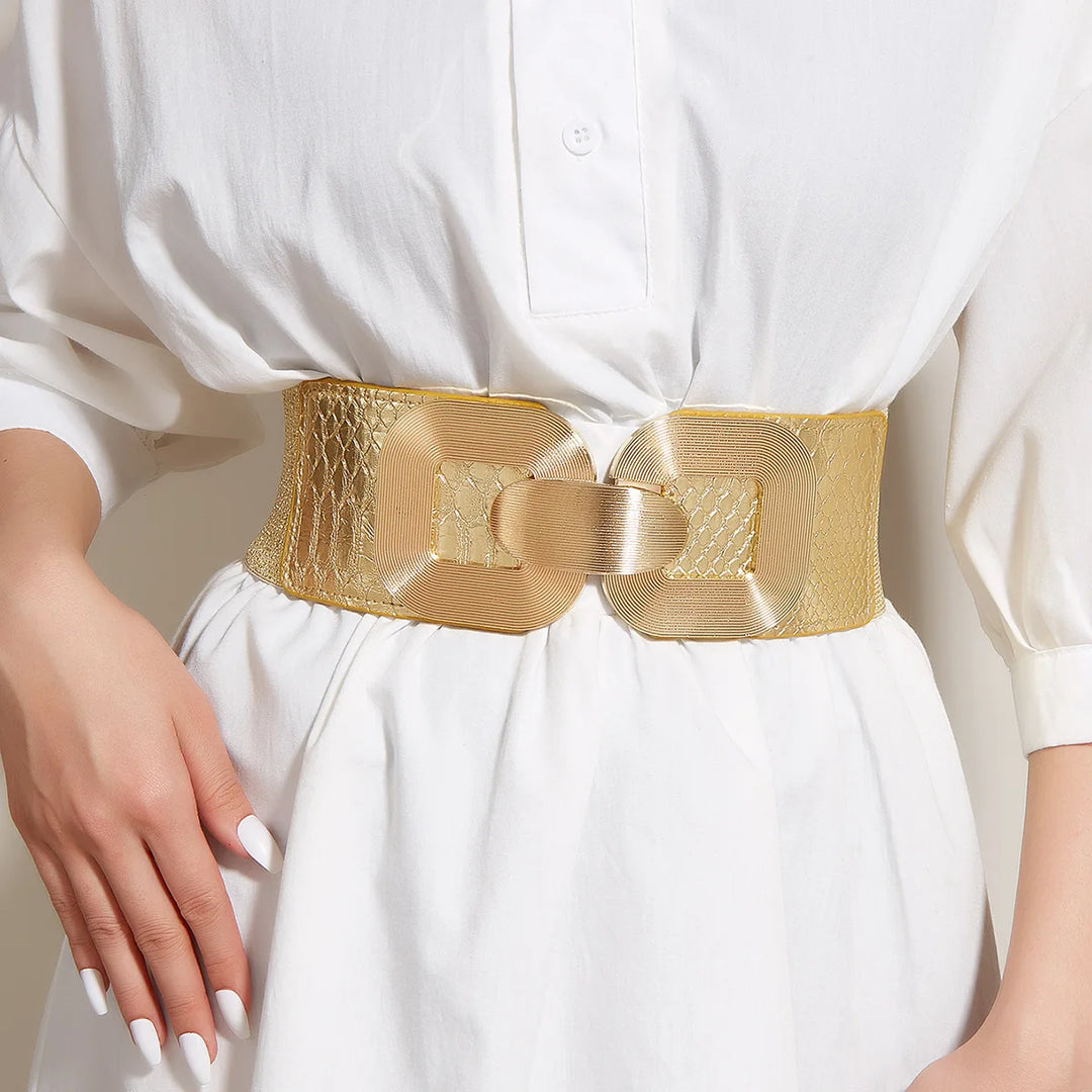 Gold wide elastic corset belt with textured pattern and centered metal buckle detail.