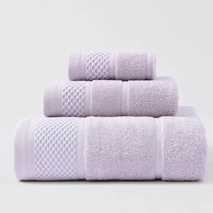 3-piece thick cotton towel set in lavender and white, folded towels with waffle accents.