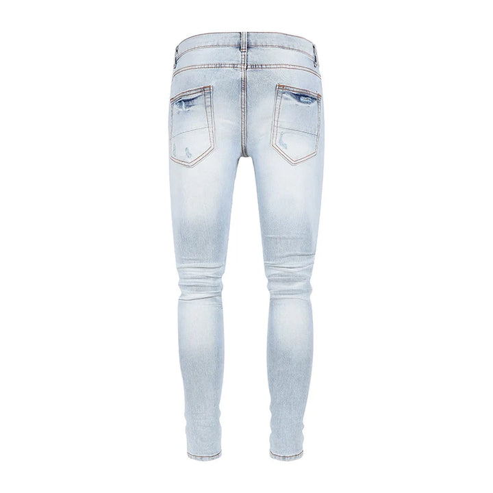 Trendy Perforated Patch Slim Jeans Pants