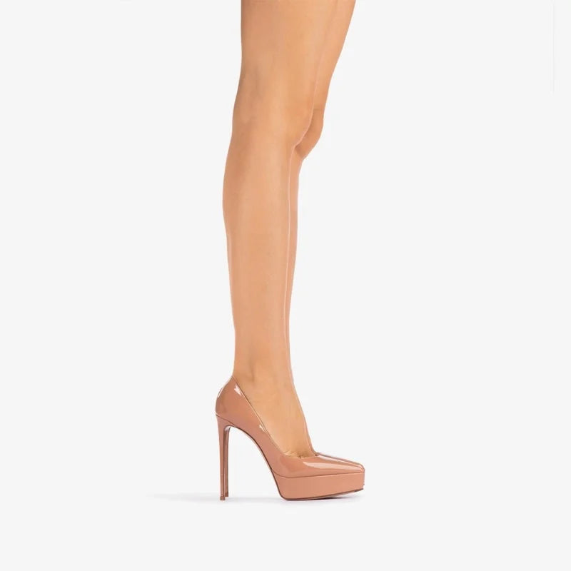 Women’s nude beige patent platform heel pumps on legs, pointed toe and stiletto heel
