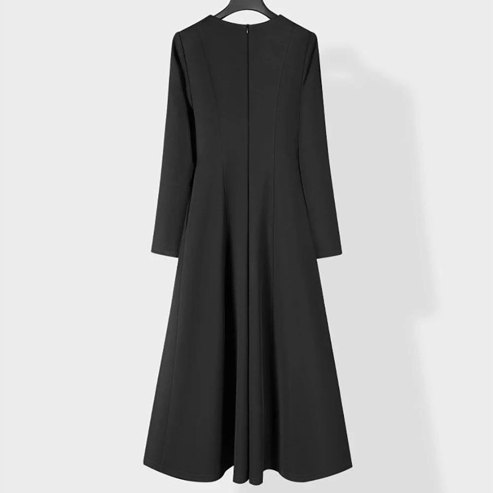 Black A-line midi dress, V-neckline and three-quarter back view with seams