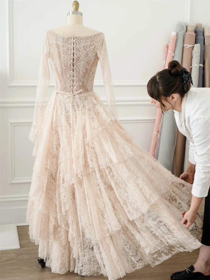 Ivory lace bridal gown with full skirt and lace bodice, side slit detail