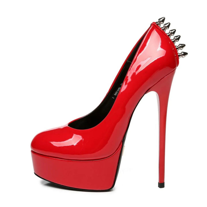Red patent leather platform rivet heel pumps with pointed toe and black inner lining