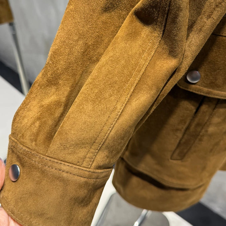 Golden-brown suede leather sleeve with stitched panel and metal snap cuff