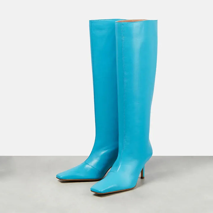Women’s knee-high glossy boots in bright blue with slim heel and side seam