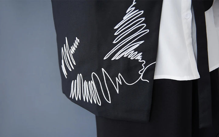 Black waistcoat with white scribble embroidery detail on the front panel